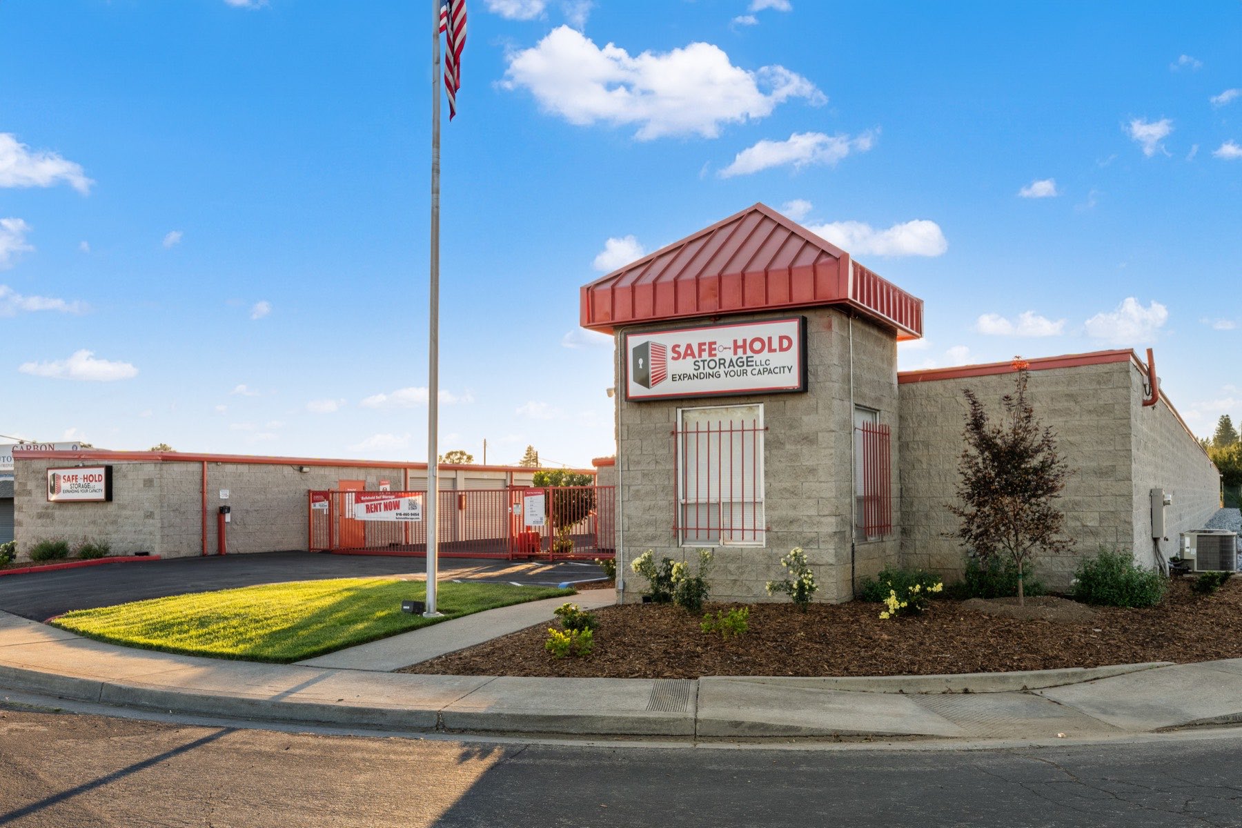 The entrance and flagpole at Safe-Hold Storage in Sacramento, California